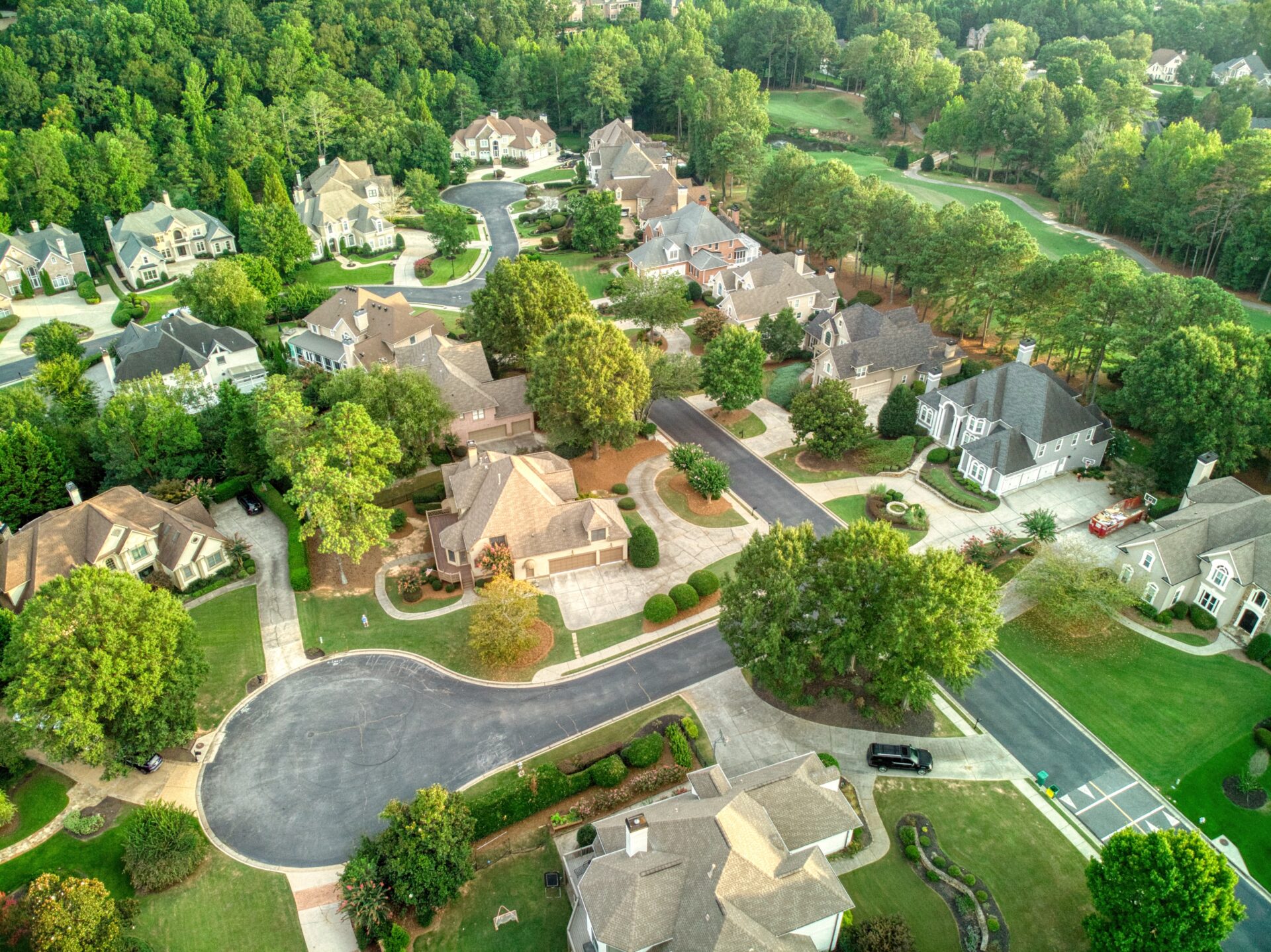 Panoramic aerial view of a beautiful subdivision in an upscale neighborhood in Georgia, USA shot during golden hour