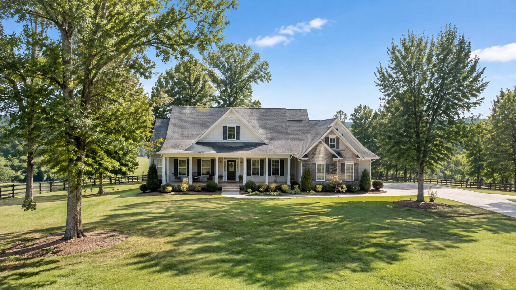 Country estate with wraparound porch and driveway Country estate with wraparound porch and driveway