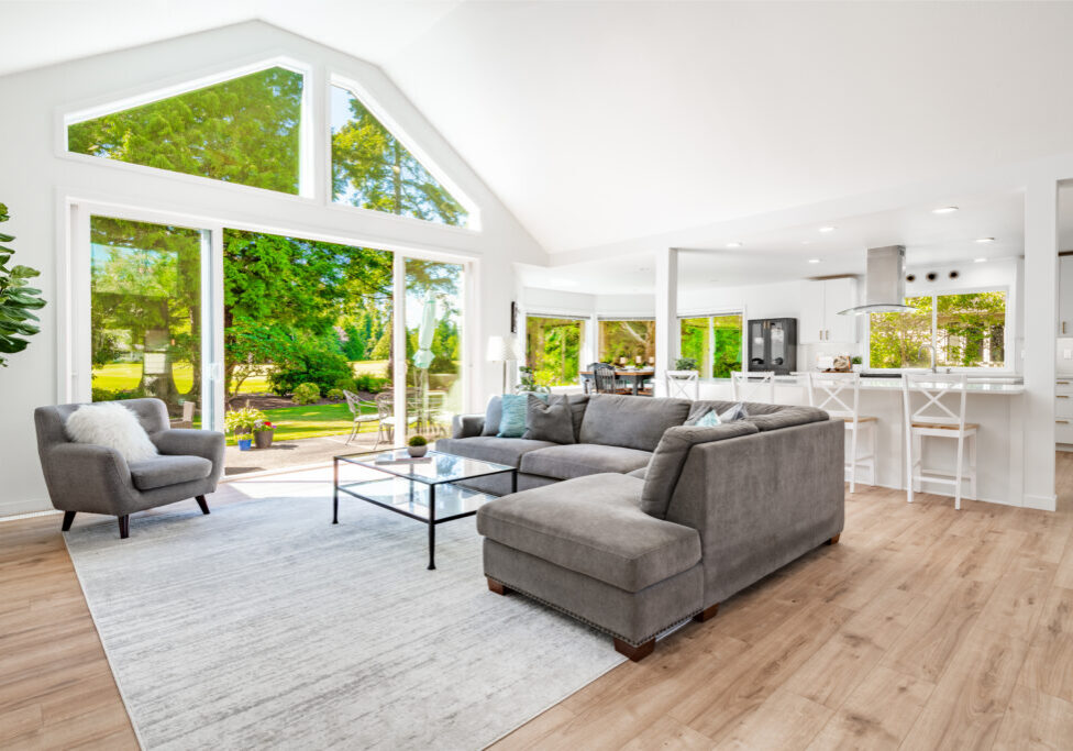 This home has large open concept room painted white with simple and stylish decor. The kitchen has expansive countertops and cupboards and cabinets with gold fixtures. Living room has wall mounted tv and an electric fireplace, the family room has 2 blue recliners and a wood burning fireplace. Rooms have multiple large windows with views to the garden and golf course beyond the backyard. Lush landscaping with mature trees. Bathroom is sparkling clean and white marble with free standing bath tub and open glass wall shower with gold fixtures.