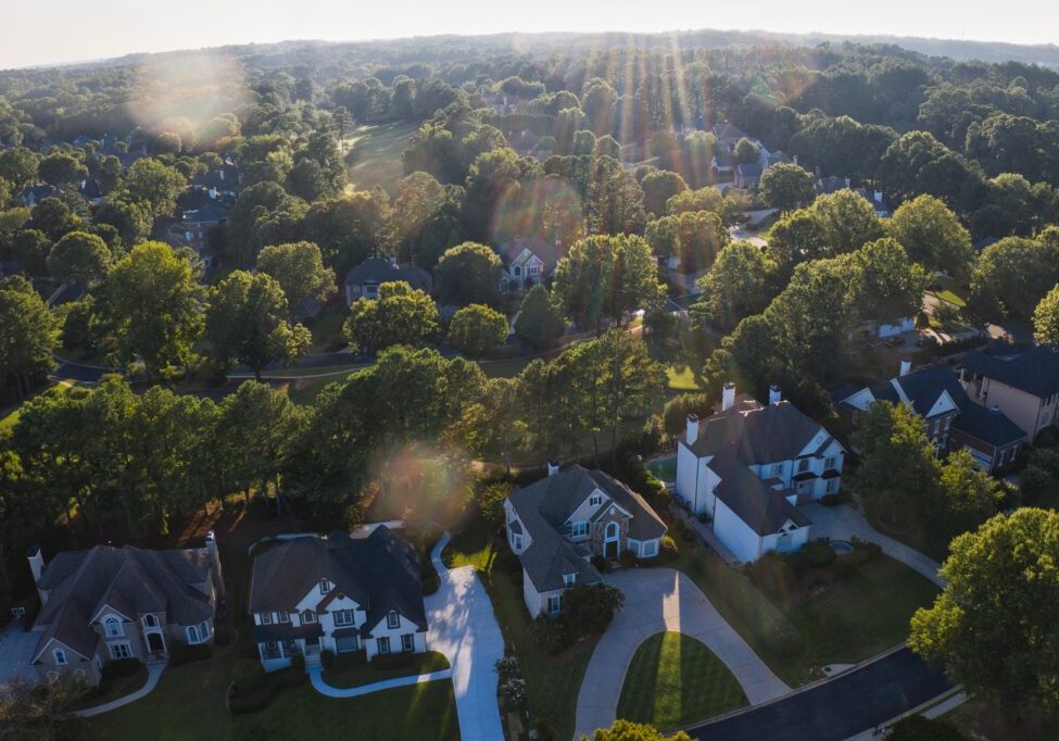 Aerial panoramic view of an upscale subdivision in suburbs of USA shot during sunset