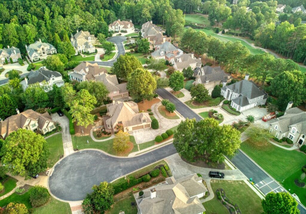 Panoramic aerial view of a beautiful subdivision in an upscale neighborhood in Georgia, USA shot during golden hour